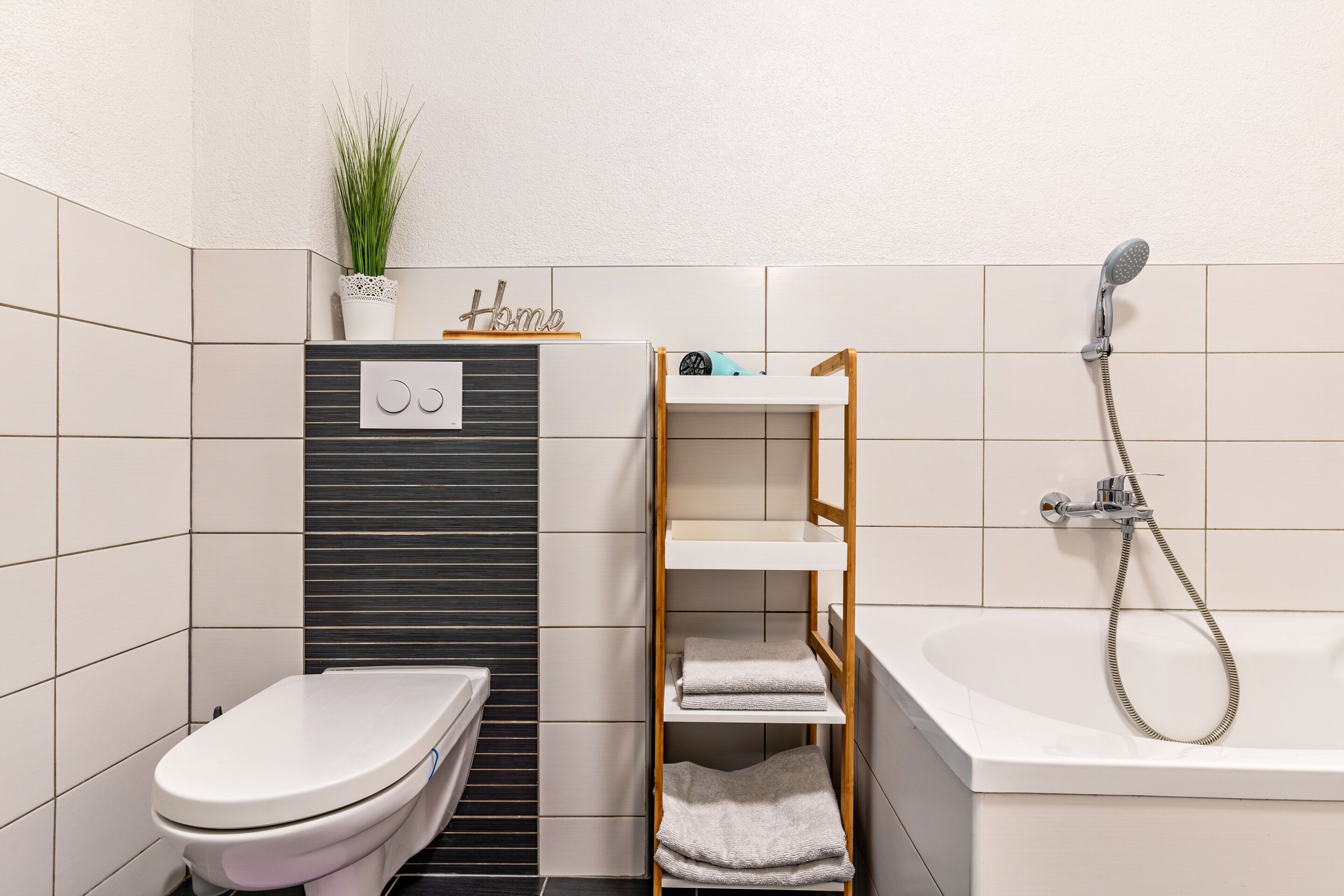 Bathtub, hair dryer, towels