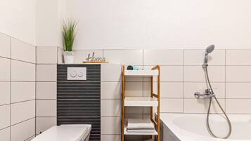 Bathtub, hair dryer, towels