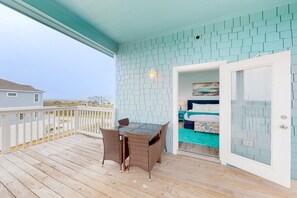 Outdoor dining - Inviting oceanfront home with pool, hot tub, tennis, fireplace, balcony & W/D (Galveston)