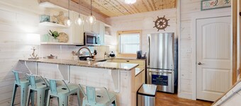 2-story home near the beach with outdoor pool, patio, washer/dryer, AC, & WiFi