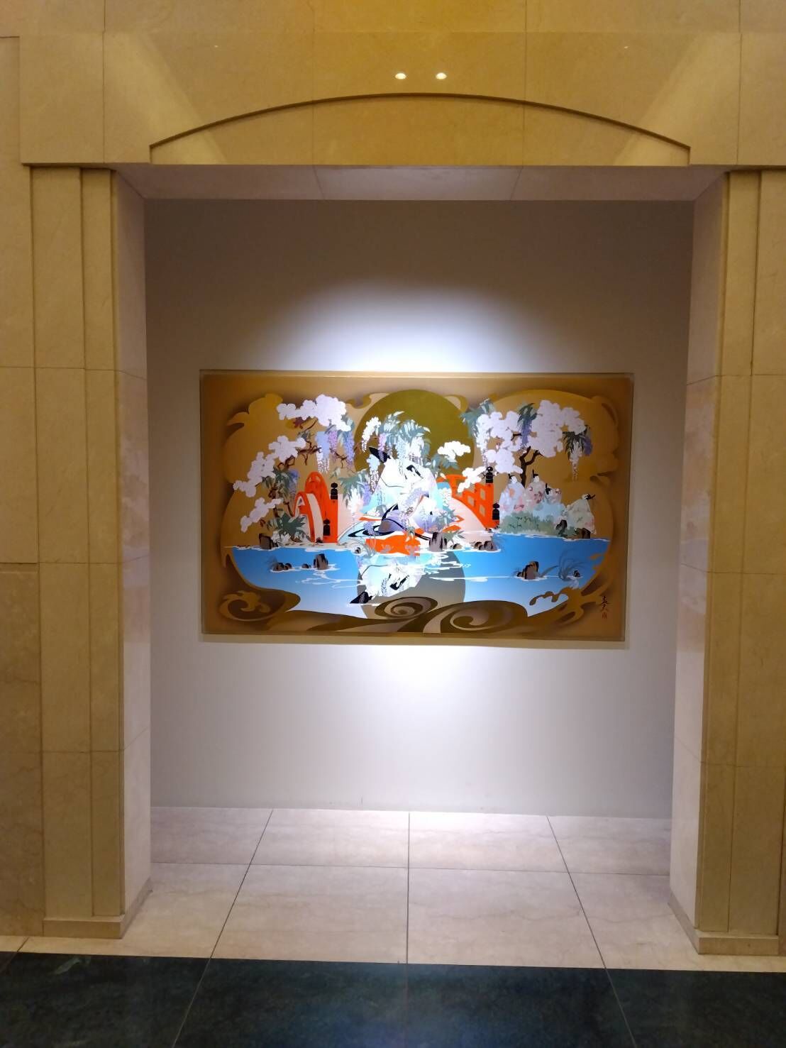 A wall with a decorative painting of a traditional scene, framed by a simple archway.