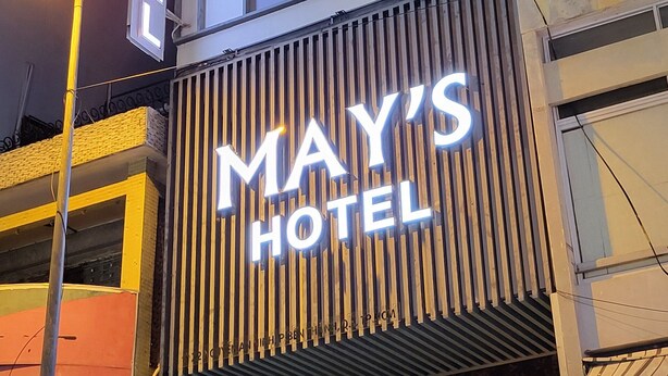 A hotel sign with the name "MAY'S HOTEL" illuminated in white letters against a dark background. - MAY'S HOTEL-BEN THANH MARKET (Ho Chi Minh City)