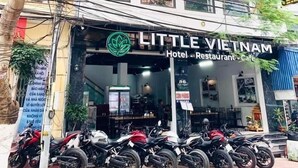 A building with a sign for "Little Vietnam Hotel, Restaurant & Cafe". - Little Vietnam Hotel - Cat Ba (Hai Phong)