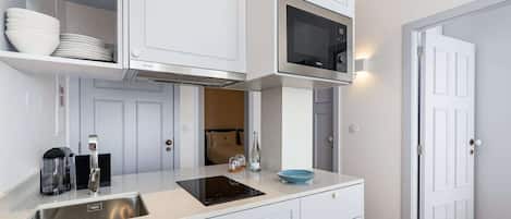 Fridge, microwave, stovetop, coffee/tea maker