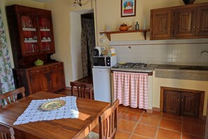 Fridge, microwave, stovetop, dining tables