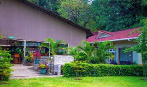 A building with a reception area, a reception desk, and a sign indicating an entry point. - Kisimani Eco Resort & Spa (Isiolo)