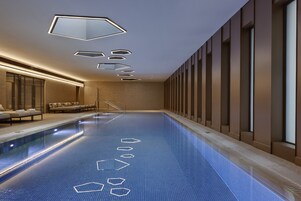 Indoor pool, open 7:00 AM to 7:00 PM, sun loungers, lifeguards on site
