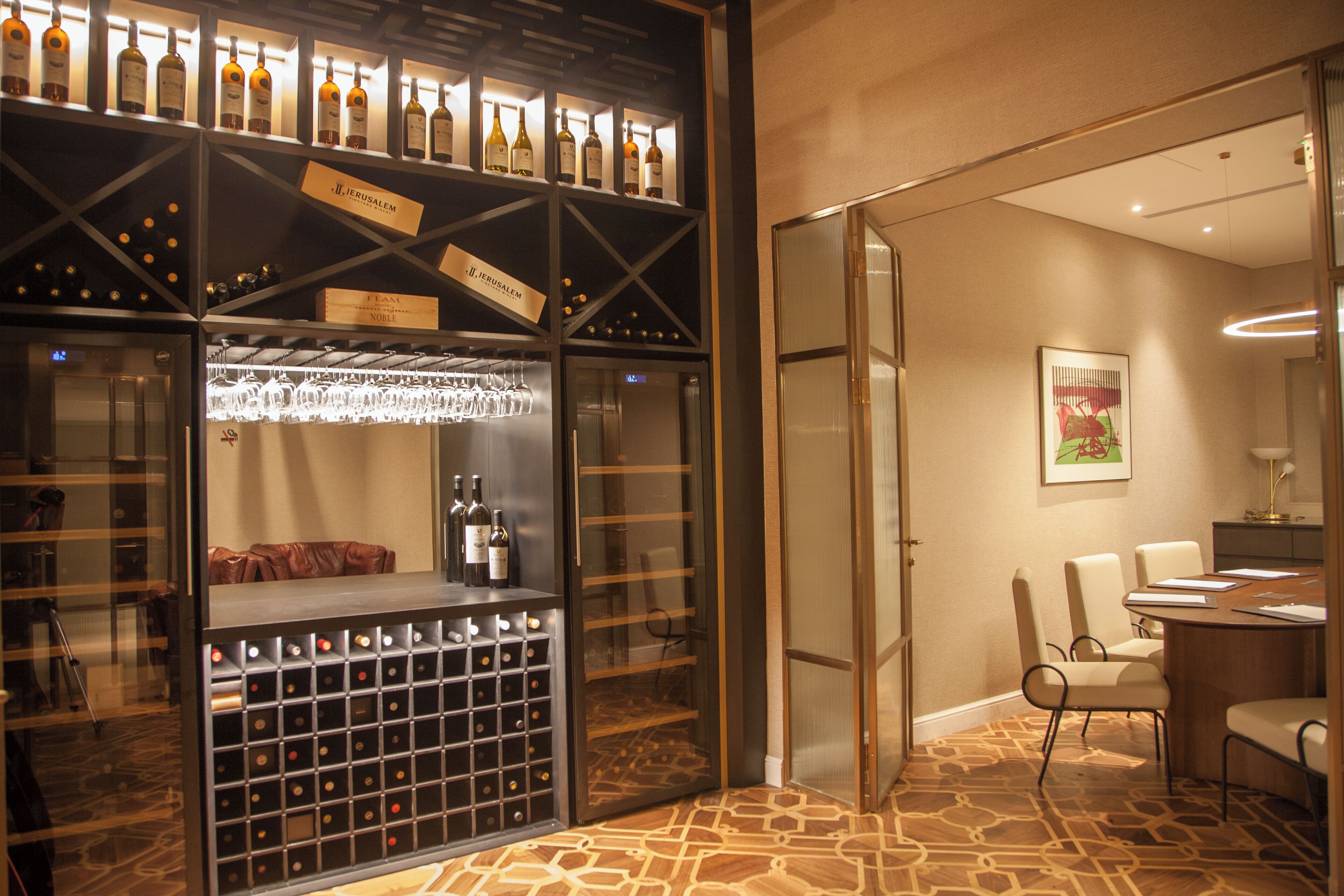 A wine cellar with wine racks and a bar area.