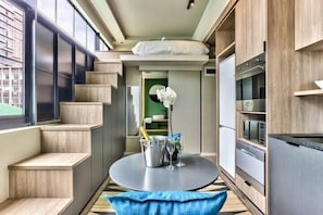 City Apartment | Living area | 50-inch flat-screen TV with cable channels, TV, Netflix