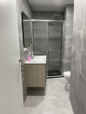 Hair dryer, towels, soap, shampoo