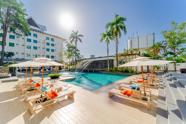 Outdoor pool, open 7:00 AM to 11:00 PM, pool umbrellas, pool loungers