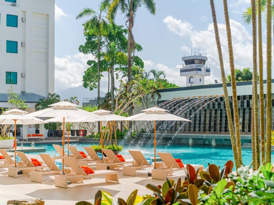 Outdoor pool, open 7:00 AM to 11:00 PM, pool umbrellas, pool loungers