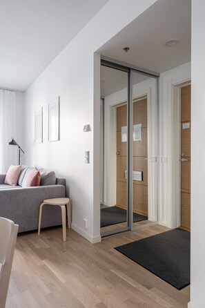 Deluxe Apartment | Living area | 40-inch Smart TV with cable channels, TV, heated floors - Stylish New 1BR Home with Sauna, Hosts 4 Guests (Tampere)