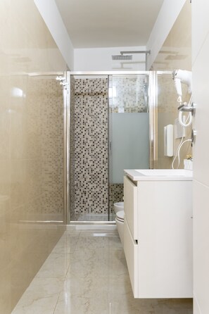 Comfort Room | Bathroom | Shower, rainfall showerhead, hair dryer, slippers