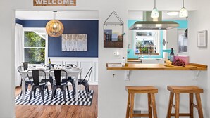 A modern kitchen with a bar area, a dining table with chairs, and a 'WELCOME' sign above the entrance. - Hot Tub! Pets! Green  Clean-Walking Distance to Proctor District (Tacoma)