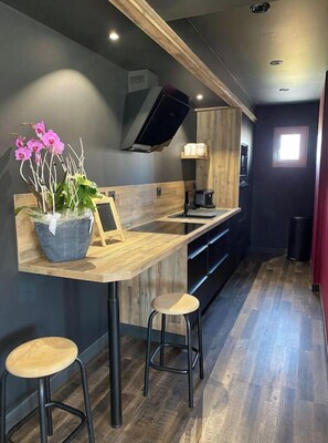 Enjoy cooking in this well-equipped kitchen with an oven, microwave, and bar seating.