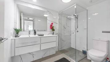 Shower, hair dryer, towels, soap