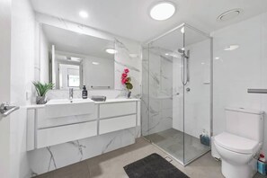 Shower, hair dryer, towels, soap