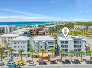 Stunning ocean views from modern buildings with palm-lined streets.