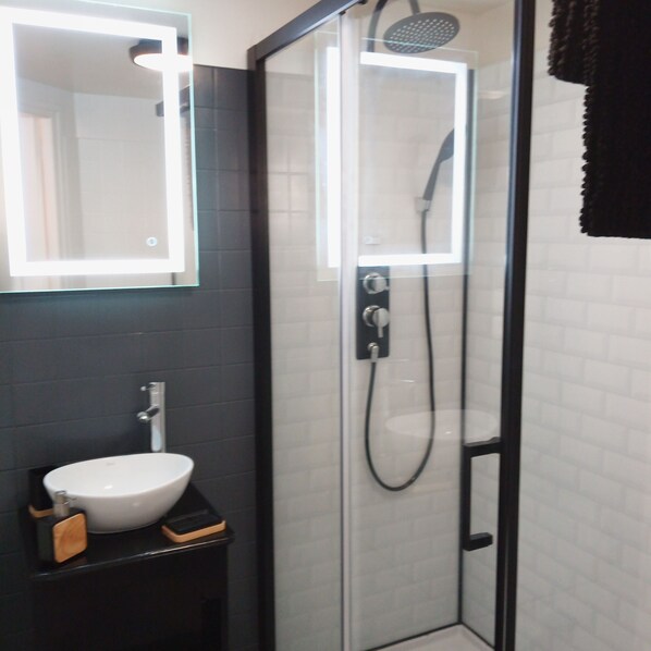 Shower, hair dryer, towels, soap