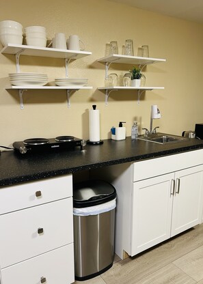 Fridge, microwave, stovetop, coffee/tea maker