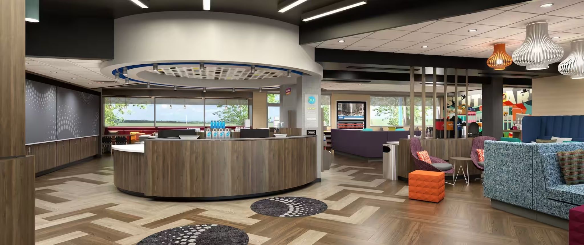 A modern reception area with a central desk, seating area with sofas, and a view of the outdoors.
