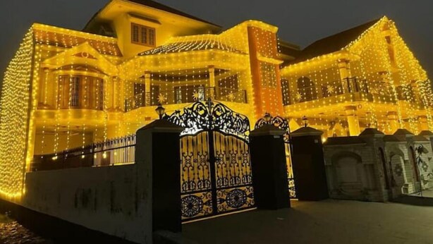 A building with a traditional architectural style, featuring a prominent entrance with ornate metalwork and a gated driveway. - Vehra Shagana Da / 8 bedrooms/ Punjab (Jalandhar)