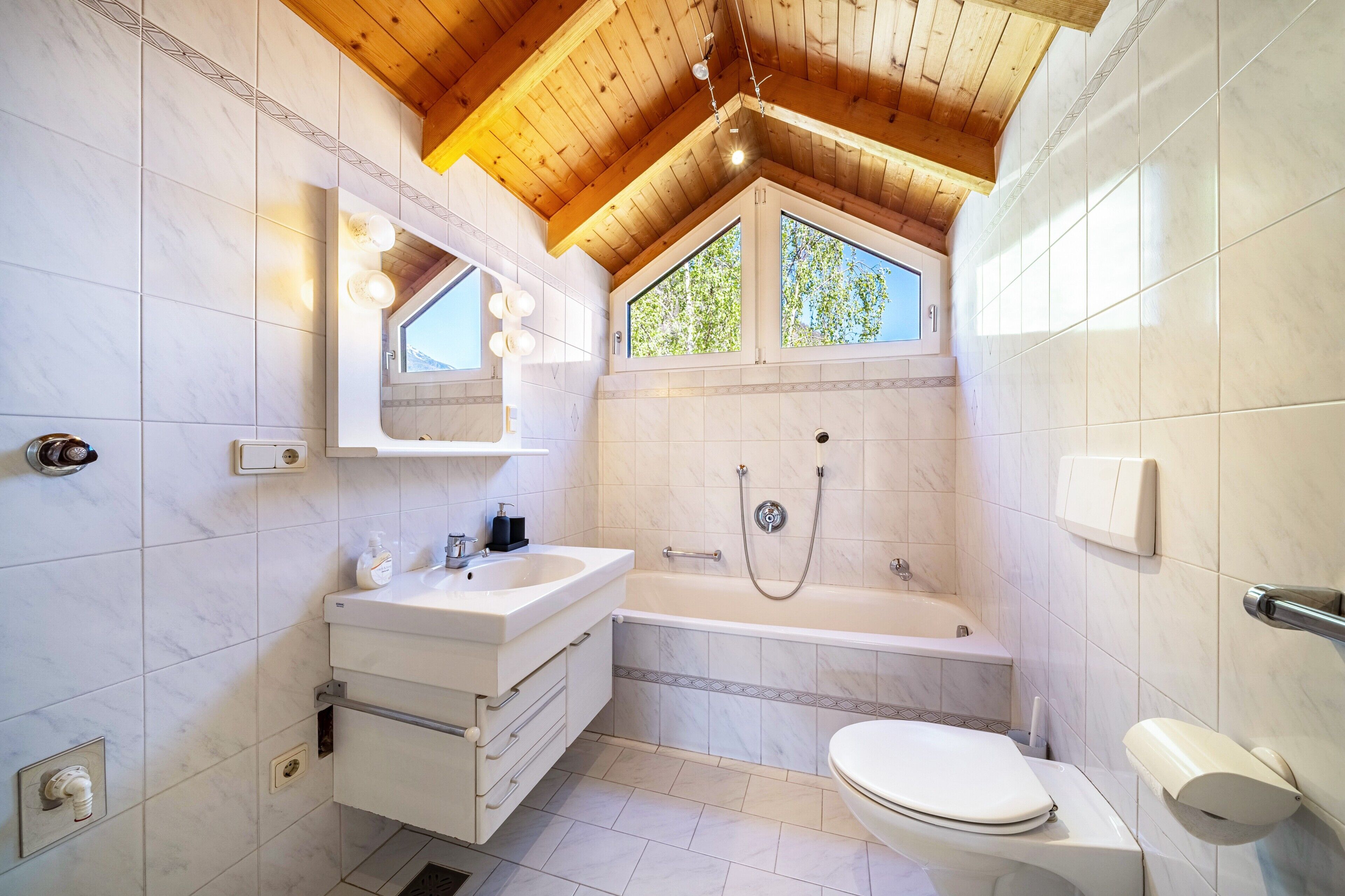 Bathtub, hair dryer, towels