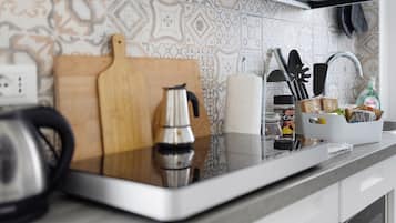 Fridge, microwave, stovetop, coffee/tea maker