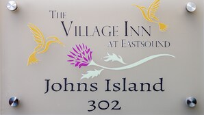 A sign for The Village Inn at Eastsound, Johns Island, 302. - Johns - Graciously Appointed (Eastsound)