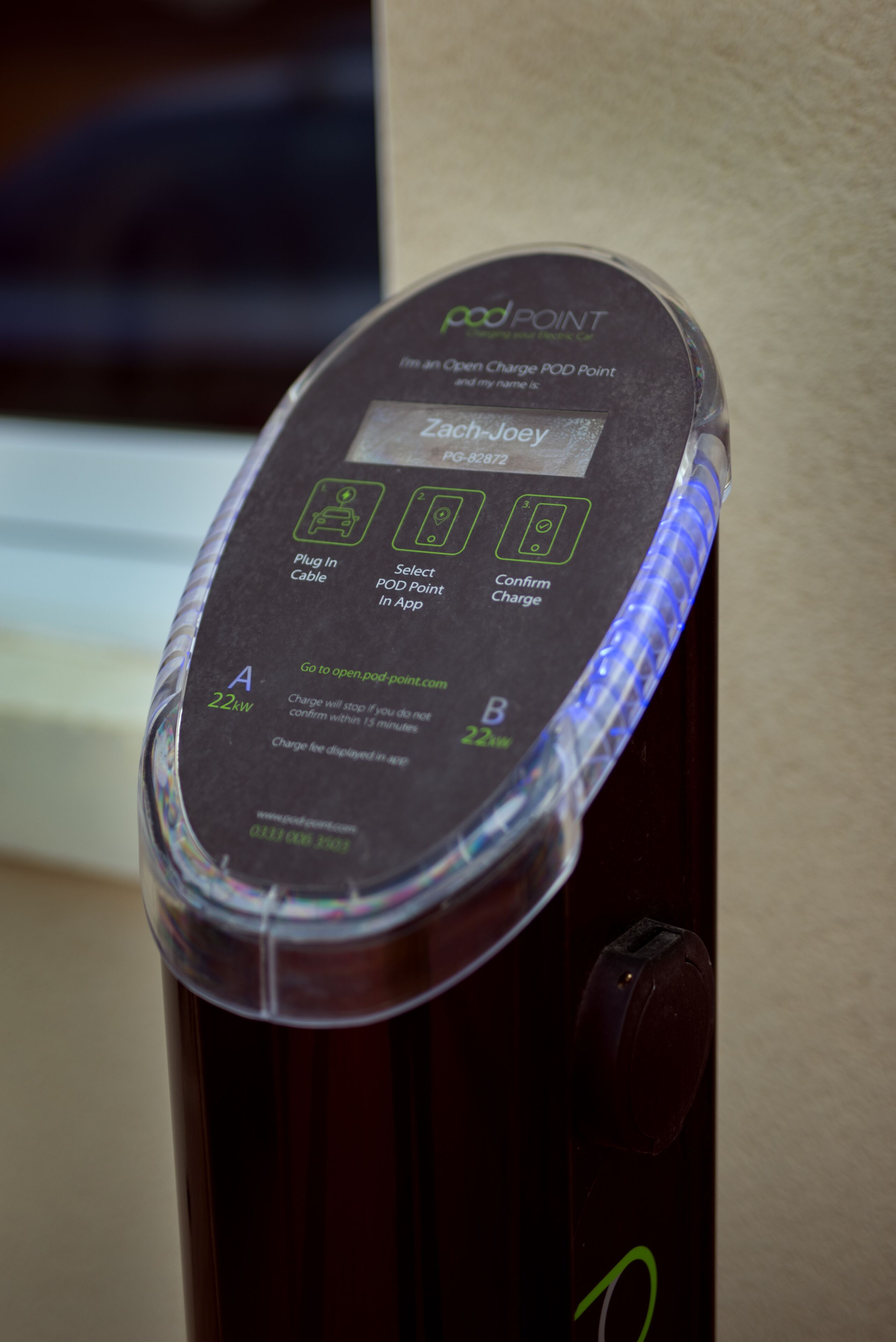 A portable charging pod with a label reading "Zach-Joey" and a capacity of "22kWh".