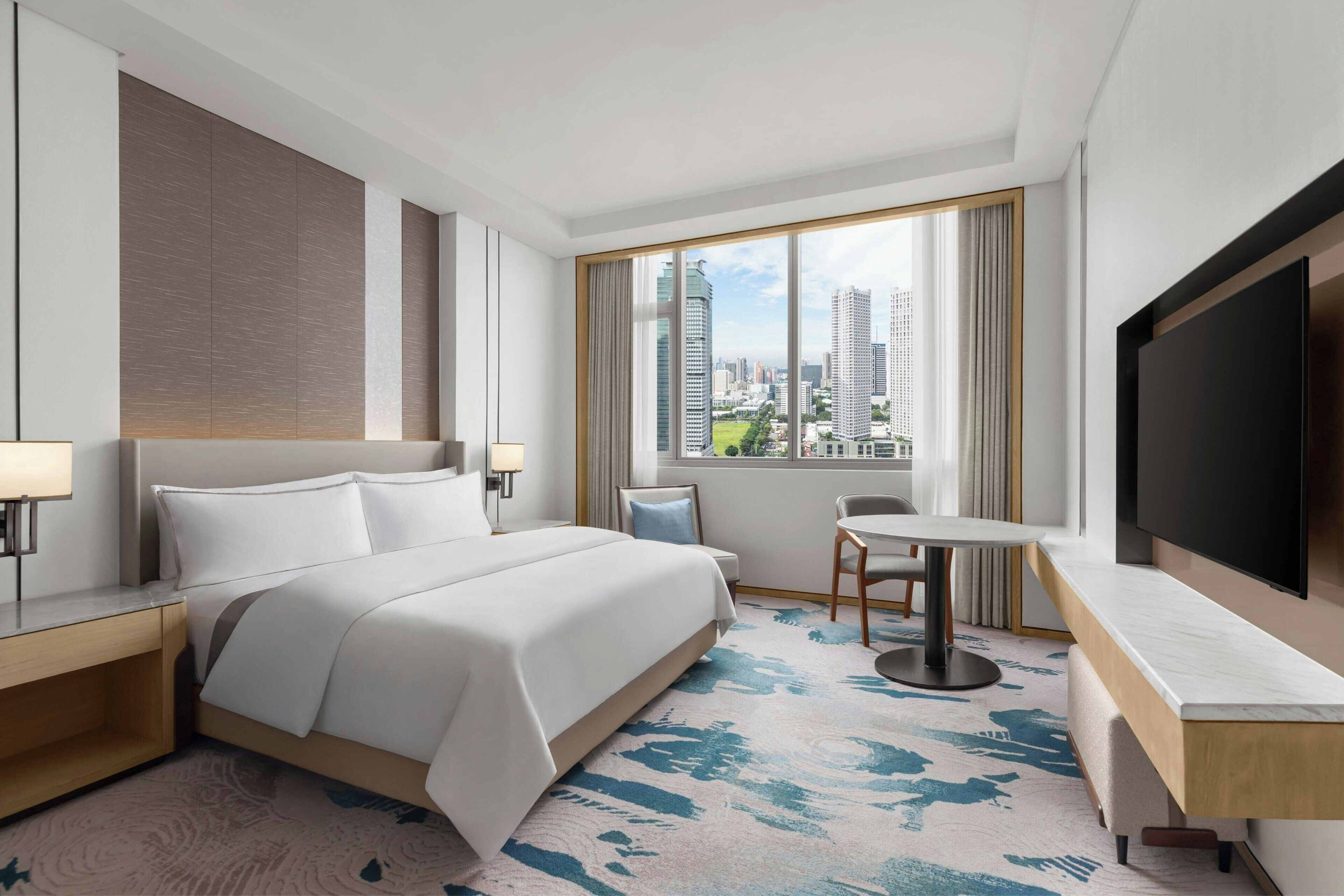 Premium bedding, down comforters, in-room safe, desk