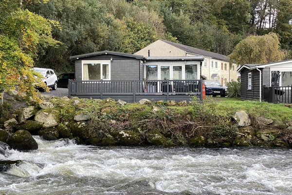 Cabin viewed from opposite side of the river