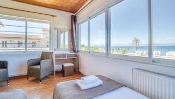 Apartment, Multiple Beds, Sea View, Beachside | Desk, iron/ironing board, free WiFi, bed sheets