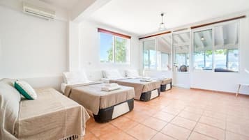 Apartment, Multiple Beds, Sea View, Ground Floor | Desk, iron/ironing board, free WiFi, bed sheets