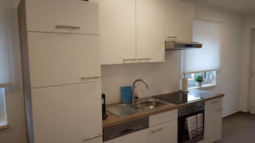 Fridge, stovetop, dishwasher, coffee/tea maker