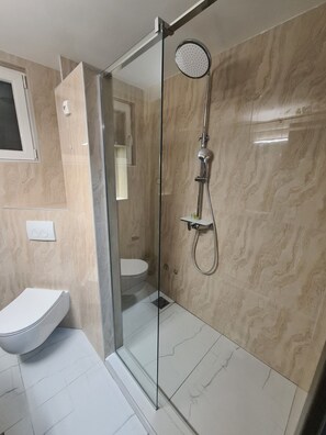 Shower, hair dryer, towels, soap