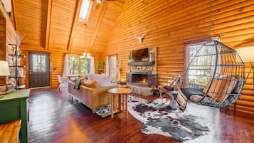 Smart TV, fireplace, books, computer monitors