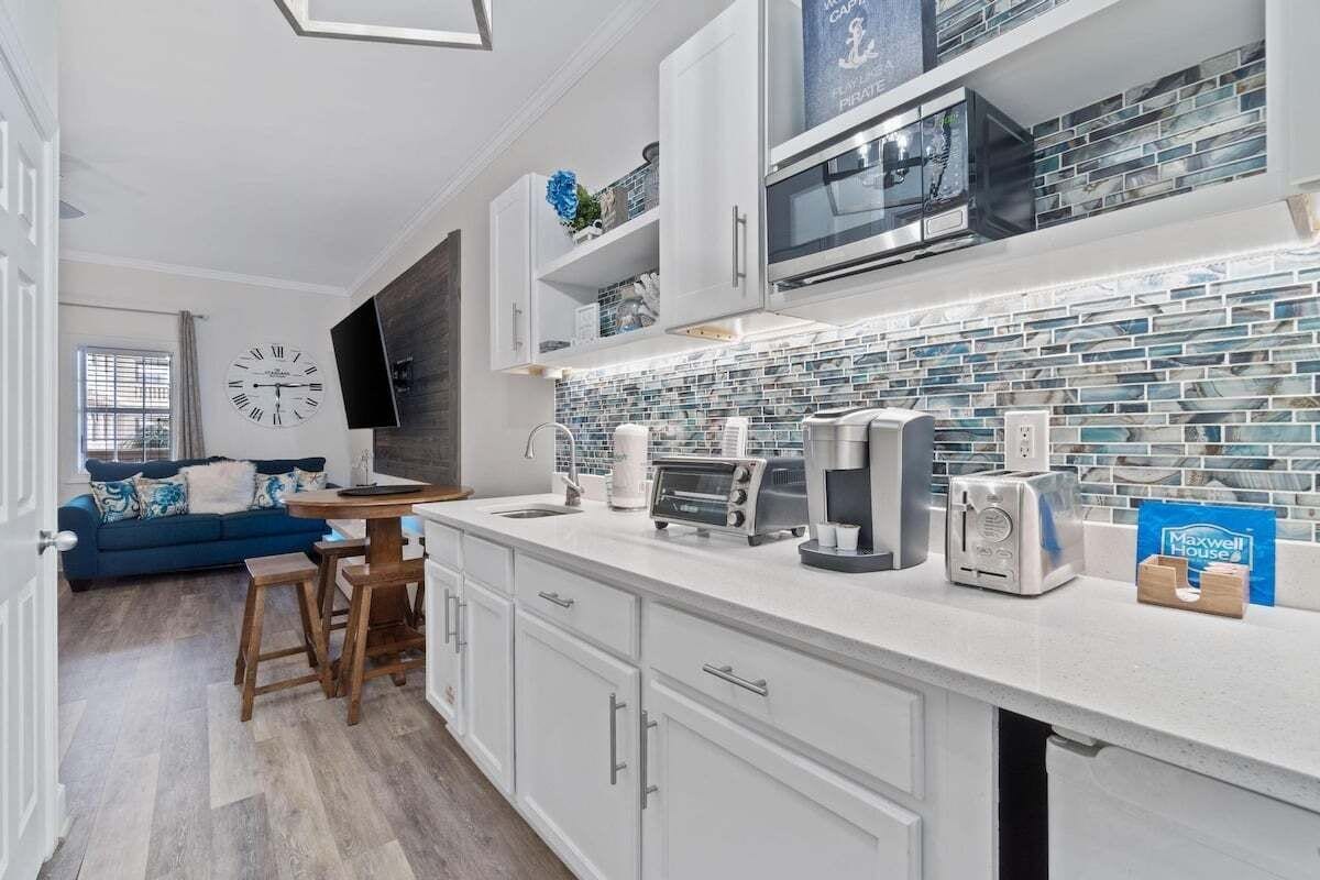 Microwave, coffee/tea maker, toaster, cookware/dishes/utensils