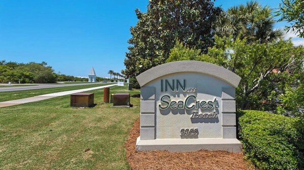 A hotel sign with the name 'INN at Sea Crest Beach' and the number '9955'.