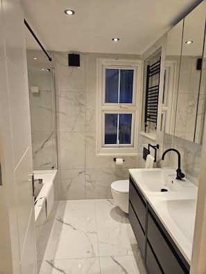 Shower, hair dryer, towels, soap