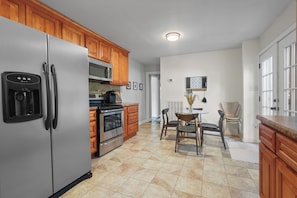 Fridge, microwave, coffee/tea maker, cookware/dishes/utensils
