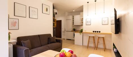 Comfort Apartment | Living area | 40-inch flat-screen TV with digital channels, TV