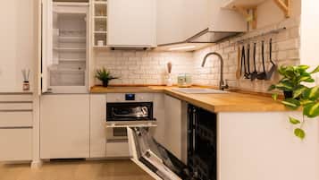 Comfort Apartment | Private kitchen | Full-size fridge, oven, stovetop, dishwasher