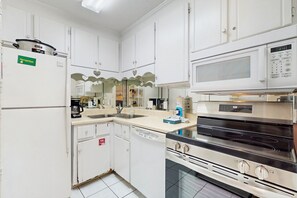 Fridge, microwave, oven, stovetop - Coastal condo with stellar shared amenities, grill, & W/D - close to the ocean (Panama City Beach)