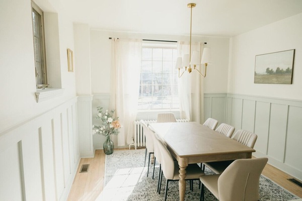 Elegant dining room with wooden table, and chandelier