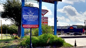 A sign for Americas Best Value Inn by Sonesta, indicating an entrance to the hotel. - Americas Best Value Inn San Antonio Airport South (San Antonio)