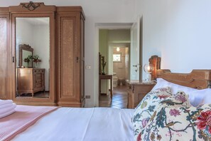 Cozy retreat with a large bed, wardrobe, and bathroom.