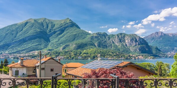 Enjoy breathtaking views of the lake and surrounding mountains from this balcony.