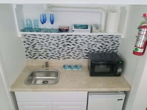 Microwave, stovetop, coffee/tea maker, toaster